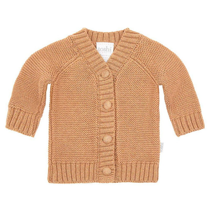 The Toshi Organic Cardigan Andy/Ginger is a light brown, knitted baby cardigan by Toshi featuring long sleeves, ribbed collar and cuffs, and four matching front buttons. Ideal as a newborn gift.