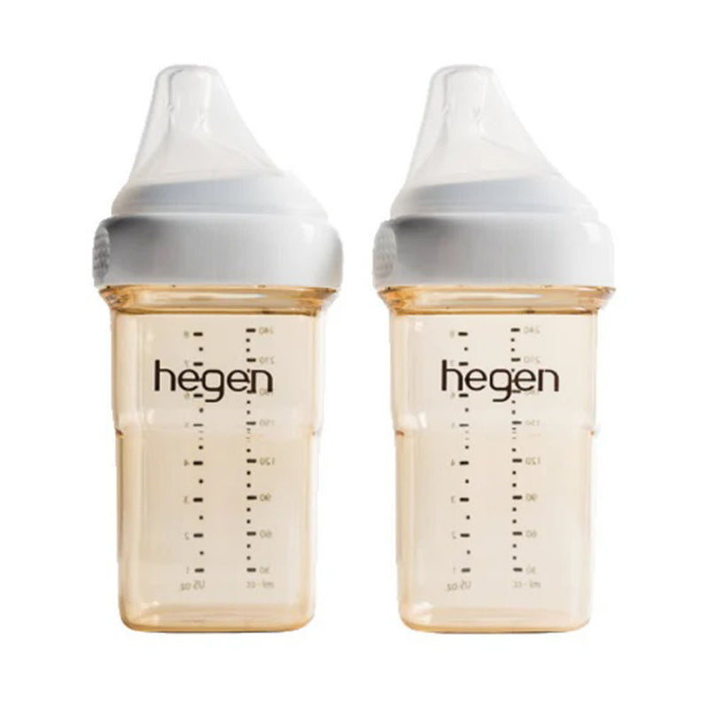 Two Hegen PCTO 240ml Feeding Bottle PPSU bottles with white caps and silicone medium flow teats, featuring measurement lines, are placed side by side against a white background. Designed to prevent colic. Brand: Hegen. 2 pack included.