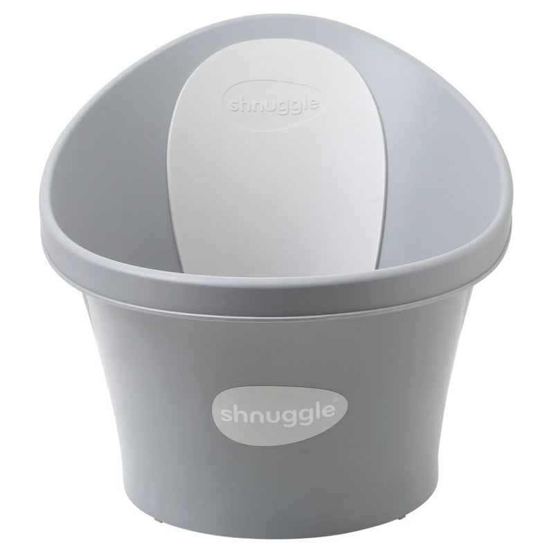 The Shnuggle Baby Bath With Plug Pebble Grey by Shnuggle features a light grey ergonomic plastic tub with a white backrest, both embossed with the "shnuggle" logo, offering gentle newborn support and a comfortable baby bath experience.