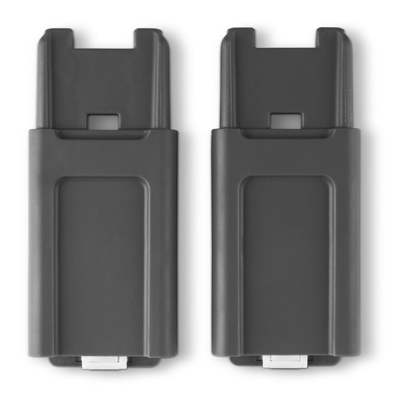 Two identical black rectangular plastic UPPAbaby Cruz Height Adapters, each with a small white connector at the bottom, shown side by side against a white background—ideal for use with your Cruz V2 or stroller adapter.