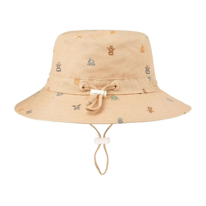 The Toshi Sunhat Folk/Cyborg Desert by Toshi is a beige children's sunhat featuring colorful robot face patterns, a chin strap, adjustable drawstring sizing, and UPF 50+ protection.