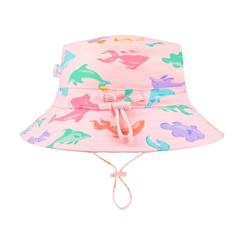 The Toshi Swim Baby Sunhat Classic/Dishy Fishy features pink UPF50+ fabric, colorful sea animal prints, and an adjustable chin strap—ideal for pairing with baby swimwear or other Toshi swim items.