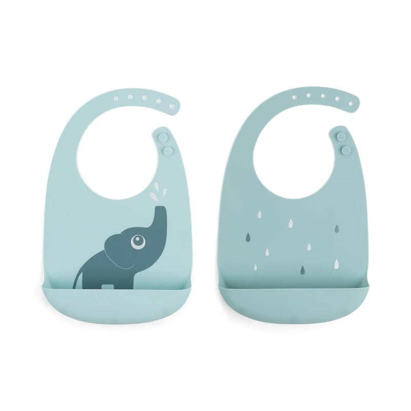 The Done By Deer Silicone Bib 2-Pack Elphee Blue features two light blue waterproof bibs with adjustable neck straps and catch-all pockets—one with an elephant spraying water, the other with raindrops—for mess-free meals.