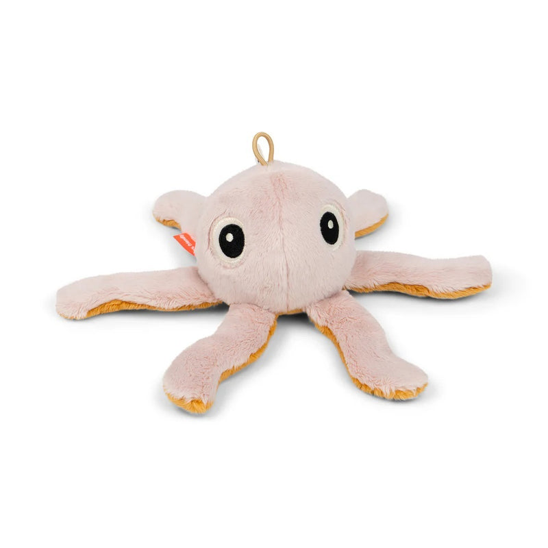 The Done By Deer Tiny Rattle Jelly Powder is a soft, light pink plush octopus sensory baby toy by Done By Deer, featuring large black eyes, six visible legs, and a fabric loop for hanging on a stroller or in the nursery.