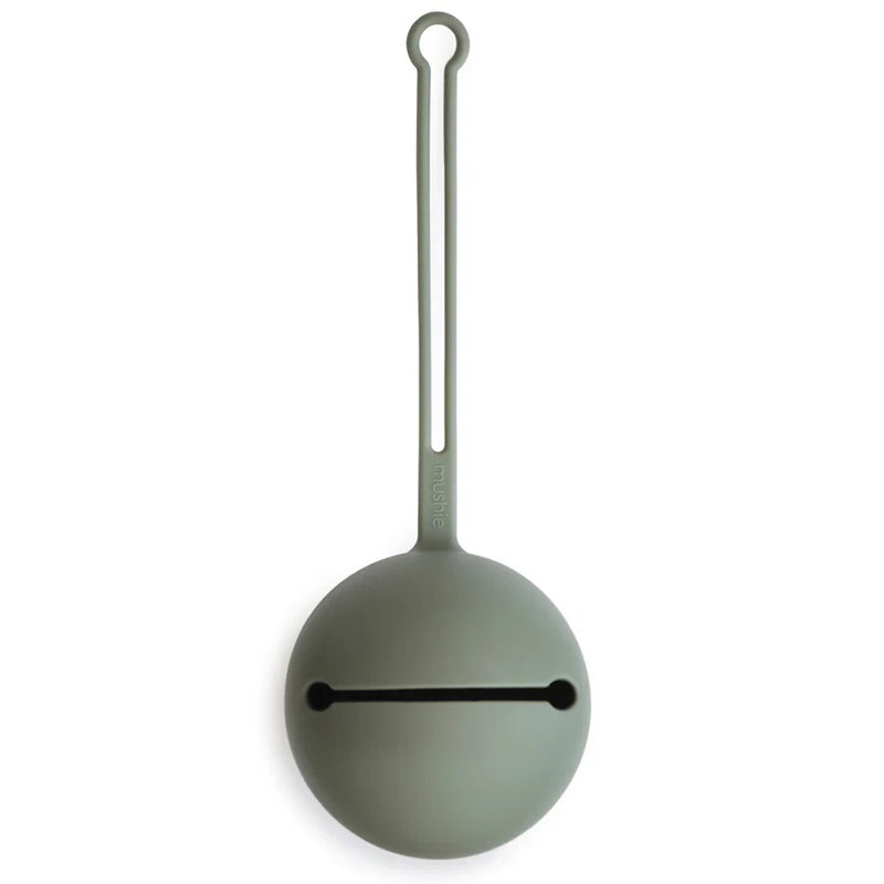 The Mushie Pacifier Case Dried Thyme by Mushie is a round, gray silicone case with a horizontal slit and an attached looped strap, designed in a minimalist, modern style.