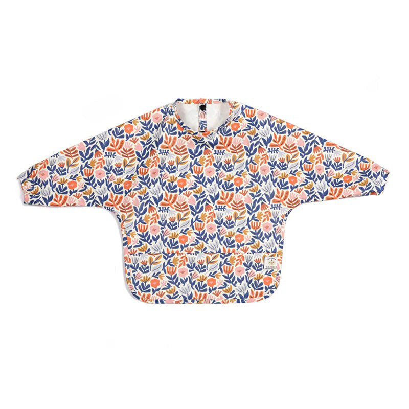 The IZIMINI Willow Bib by IZIMINI is a waterproof long sleeve bib with a vibrant pattern of orange, blue, and pink flowers and leaves on a white background, shown flat to display the full design.