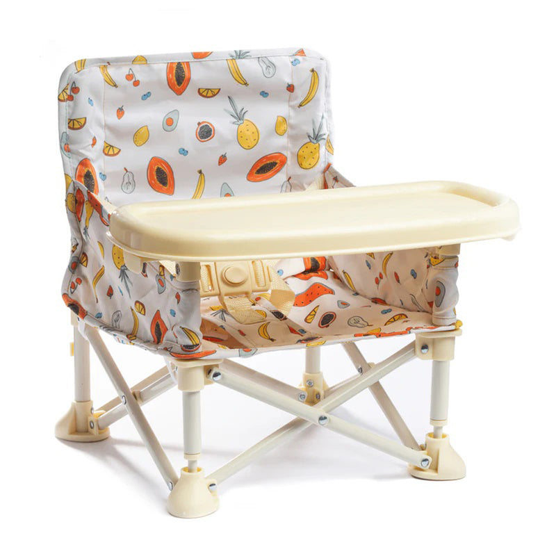 The IZIMINI Clementine Baby Chair V2 is a portable booster seat with tray, featuring a colorful fruit pattern. This Australian favorite includes a harness and folding legs for easy transport.