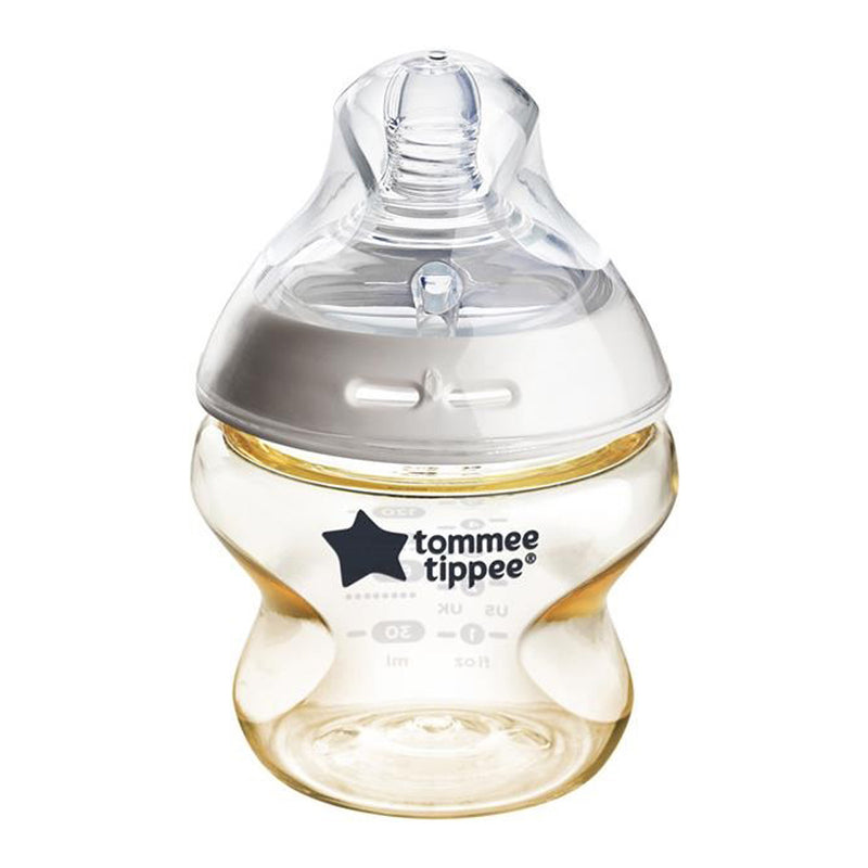 A Tommee Tippee Natural Start 150ml PPSU baby bottle with a slow silicone teat, white collar, measurement markings, and BPA-free wide neck holds a light yellow liquid.