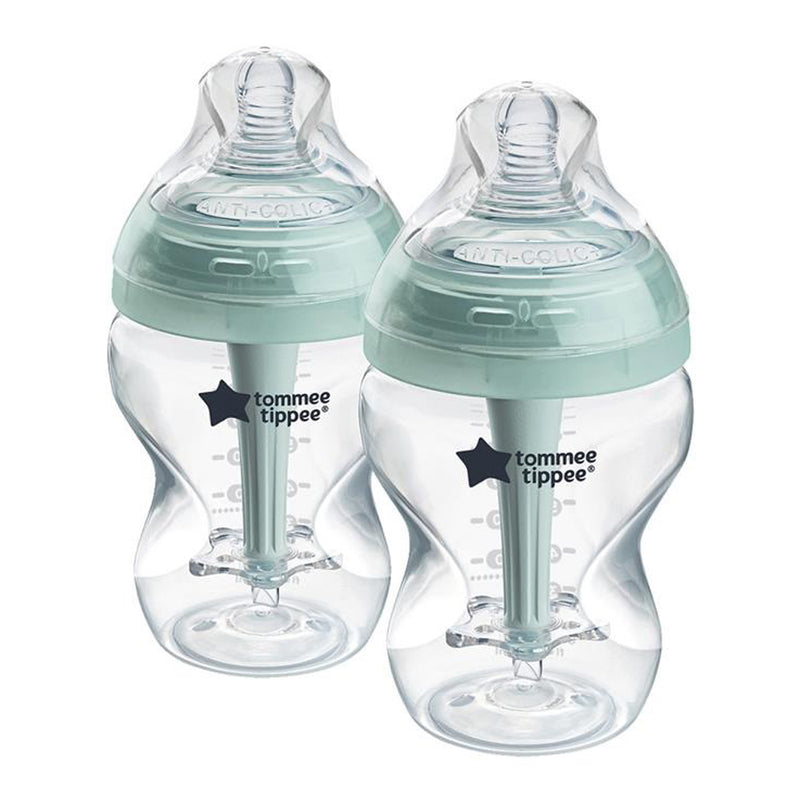 Two Tommee Tippee Advanced Anti-Colic 260ml bottles with mint green caps and vented wands are placed together. Wide nipples and measurement markings help make feeding comfortable for your baby.