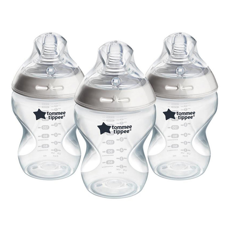 Three Tommee Tippee Natural Start 260ml bottles, BPA free, with white lids and silicone nipples are arranged side by side. Each bottle shows measurement markings and the Tommee Tippee logo. Set contains 3 bottles.