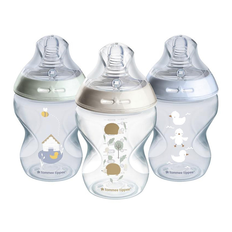 The Tommee Tippee Natural Start 3x 260ml PP Bottles Boy set features three BPA-free breast-like bottles with animal-themed designs: a duck with a beehive, a hedgehog with leaves, and three white ducks.