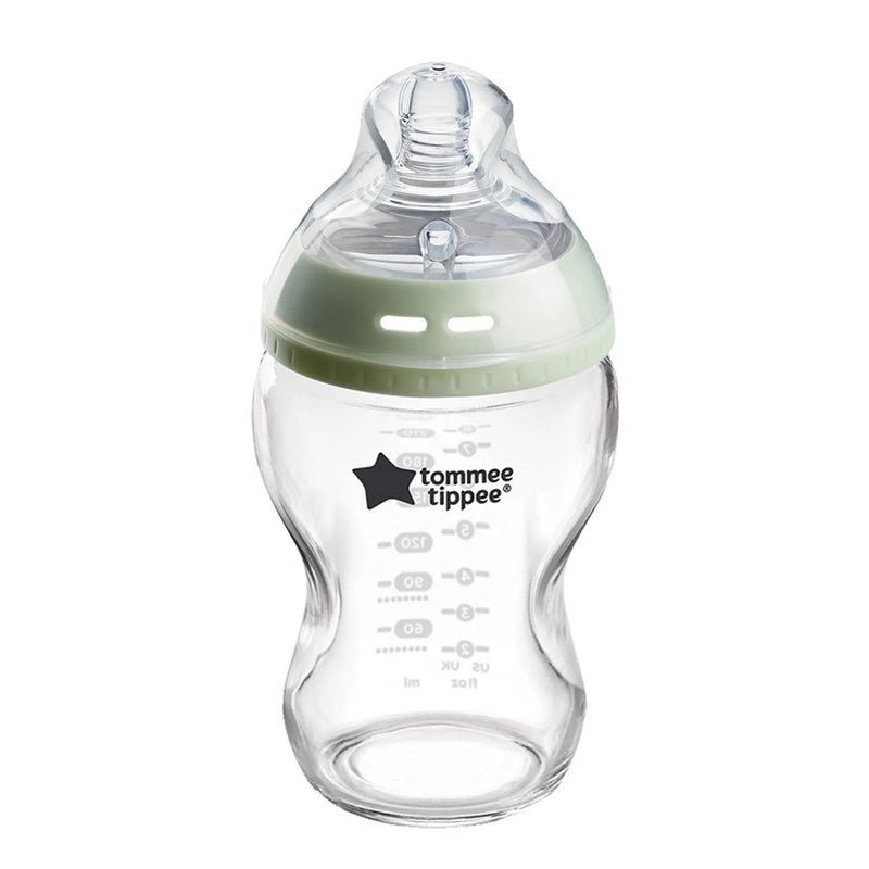 The Tommee Tippee Natural Start 250ml glass bottle with a slow teat features the brand logo, clear measurement lines, a green ring, and an anti-colic valve for comfortable BPA-free feeding.