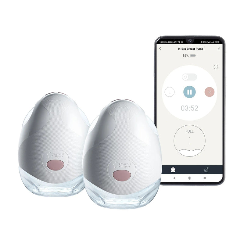 Two white, oval-shaped Tommee Tippee Double Wearable Breast Pumps are displayed beside a smartphone showing the Tommee Tippee app, which allows users to monitor and adjust pump activity and status in real time.