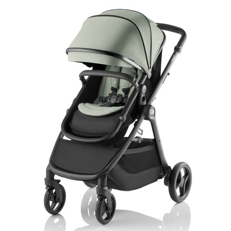 The Britax Safe-n-Sound One2 Stroller features a mint green canopy and seat, black frame, four wheels, adjustable handlebar, and an under-seat storage basket. Travel system compatible. Shown on a white background.