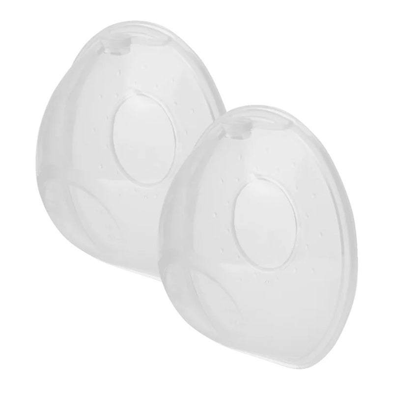 The New Beginnings Breastmilk Collectors by New Beginnings are two transparent, oval silicone collectors with a central opening and small holes on top, designed to be worn inside a bra for leak-proof milk collection or nipple protection.