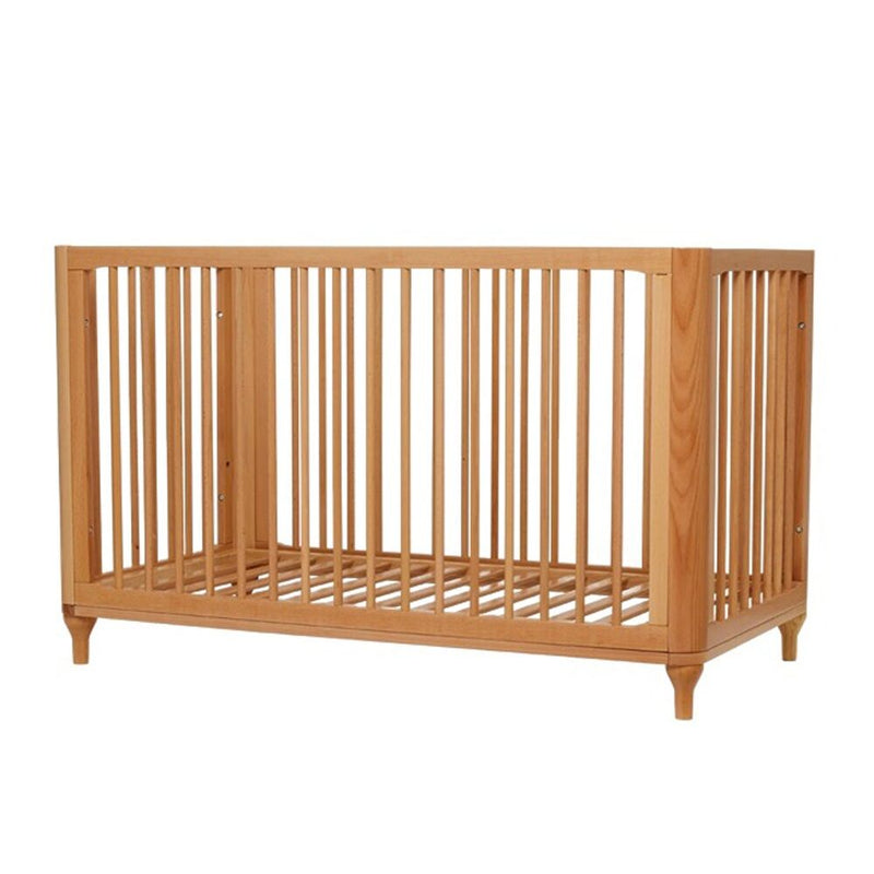 The ErgoPouch Lyra Cot by ErgoPouch is a wooden convertible cot with vertical slats, short legs, and a minimalist design. Set against a plain white background, it easily transforms into a toddler bed as your child grows.