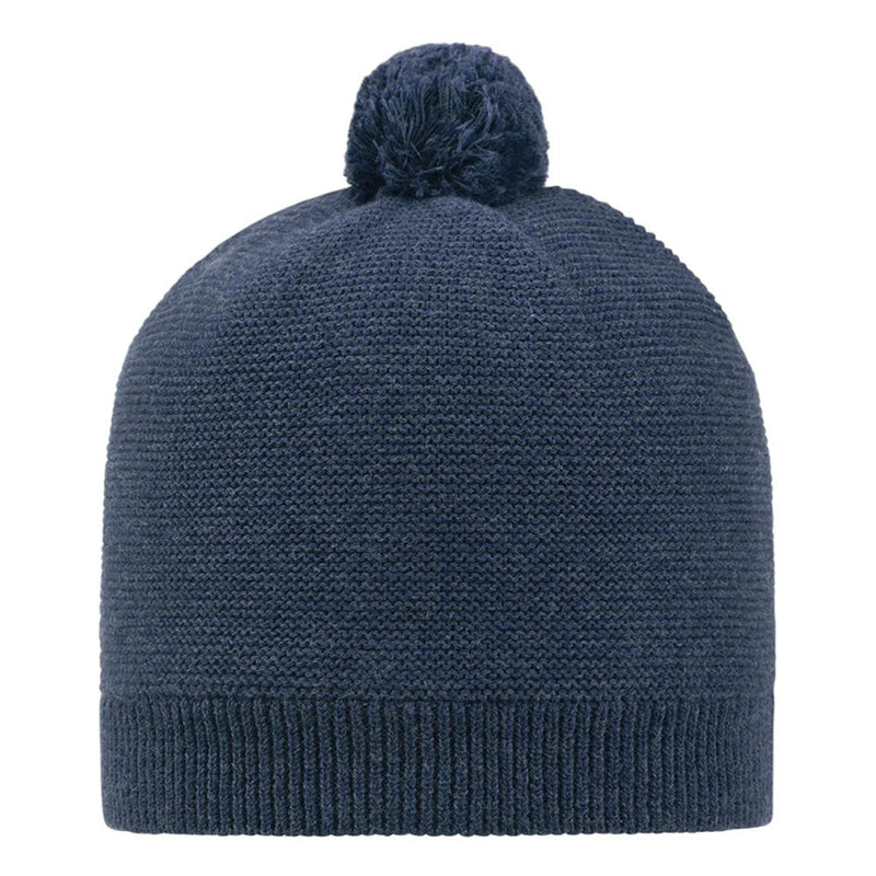 The Toshi Organic Beanie Love/Ink is a dark blue, gender-neutral pom pom beanie with a folded brim, crafted from soft knit by Toshi and shown against a white background.
