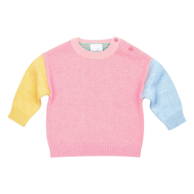The Toshi Organic Pullover Bobby/Carmine is an organic cotton baby sweater featuring a pastel pink body, yellow left sleeve, blue right sleeve, and two buttons on the left shoulder.
