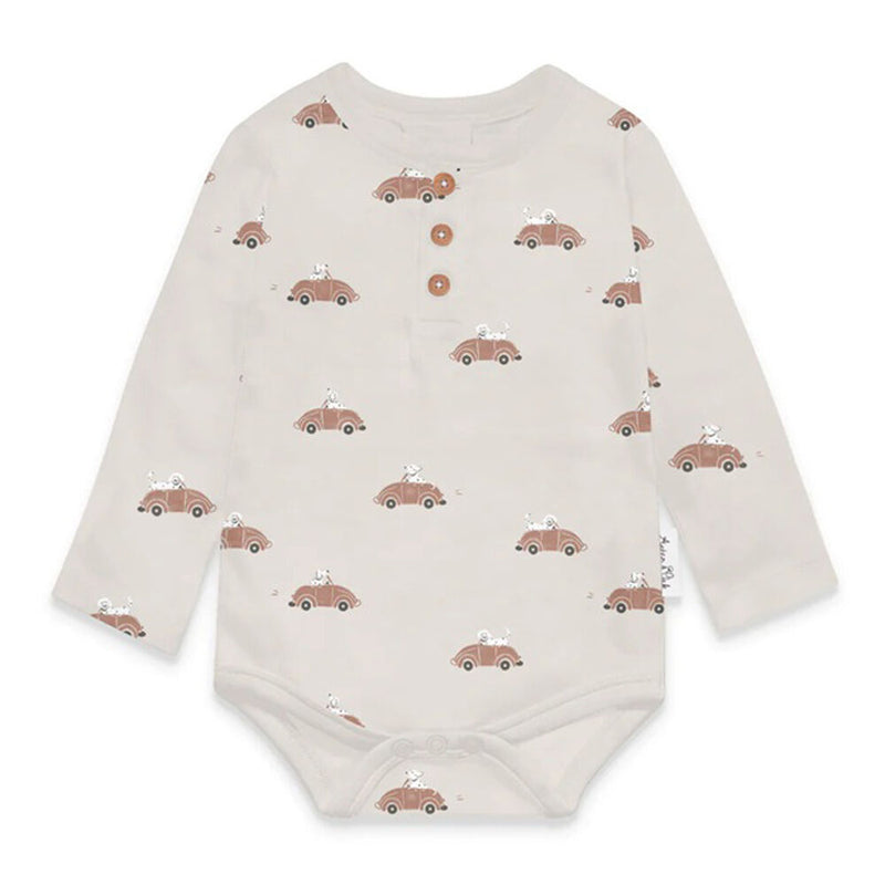 The Aster & Oak Classic Car Henley Onesie is a cream-colored organic cotton long-sleeve bodysuit adorned with small brown cars and animals, finished with three brown chest buttons and a snap closure for easy dressing.