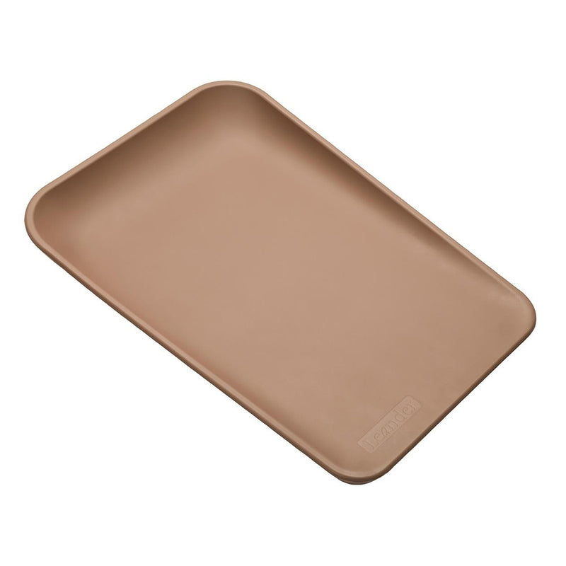 The Leander Matty Change Top by Leander is a brown, rectangular changing mat with rounded corners and raised edges, made of smooth material, shown on a white background.