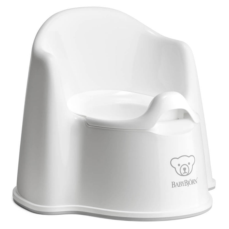 The BabyBjorn Potty Chair is a white ergonomic potty with a high backrest and splash guard, featuring the BabyBjorn logo and bear graphic—ideal for comfortable potty training.