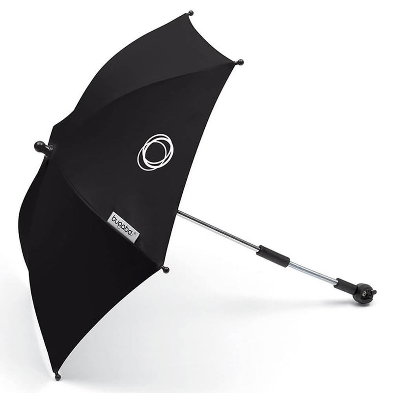 A black Bugaboo Parasol by Bugaboo with a circular white logo on the canopy and a silver handle with a mounting clamp lies on its side, designed as a stroller sunshade offering UPF 50+ protection.