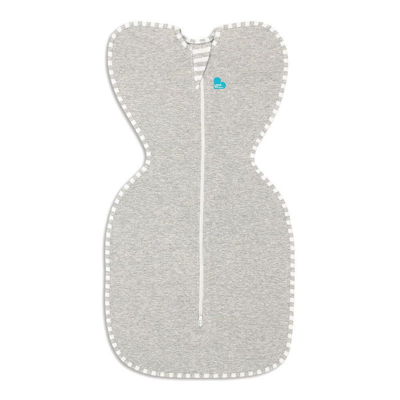 The Love To Dream Swaddle UP Original 1.0 Tog by Love To Dream is a grey, wing-shaped zip-up swaddle with a white center zipper and striped trim, designed to encourage self-soothing for babies.