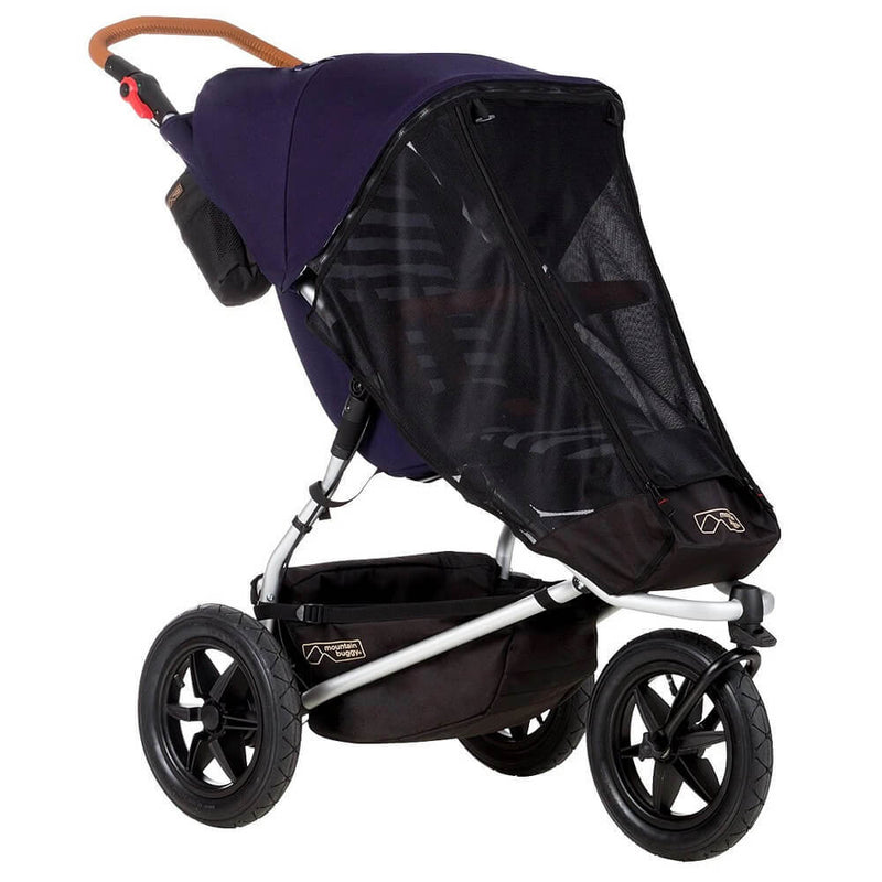 The Mountain Buggy Sun Cover by Mountain Buggy is shown side view in black and purple, featuring large wheels and a mesh cover for insect protection over the seat against a white background.