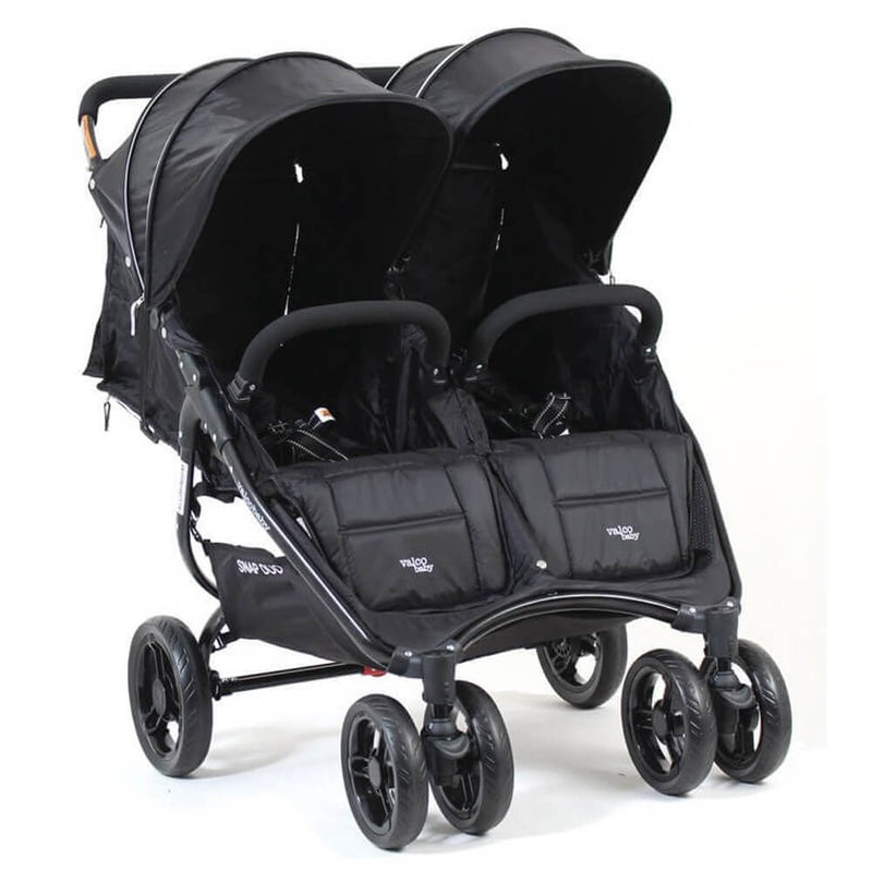 The Valco Baby Snap Duo Black Beauty is a lightweight side-by-side twin stroller in classic black with two seats, each featuring an individual canopy and footrest, plus four wheels for stability.