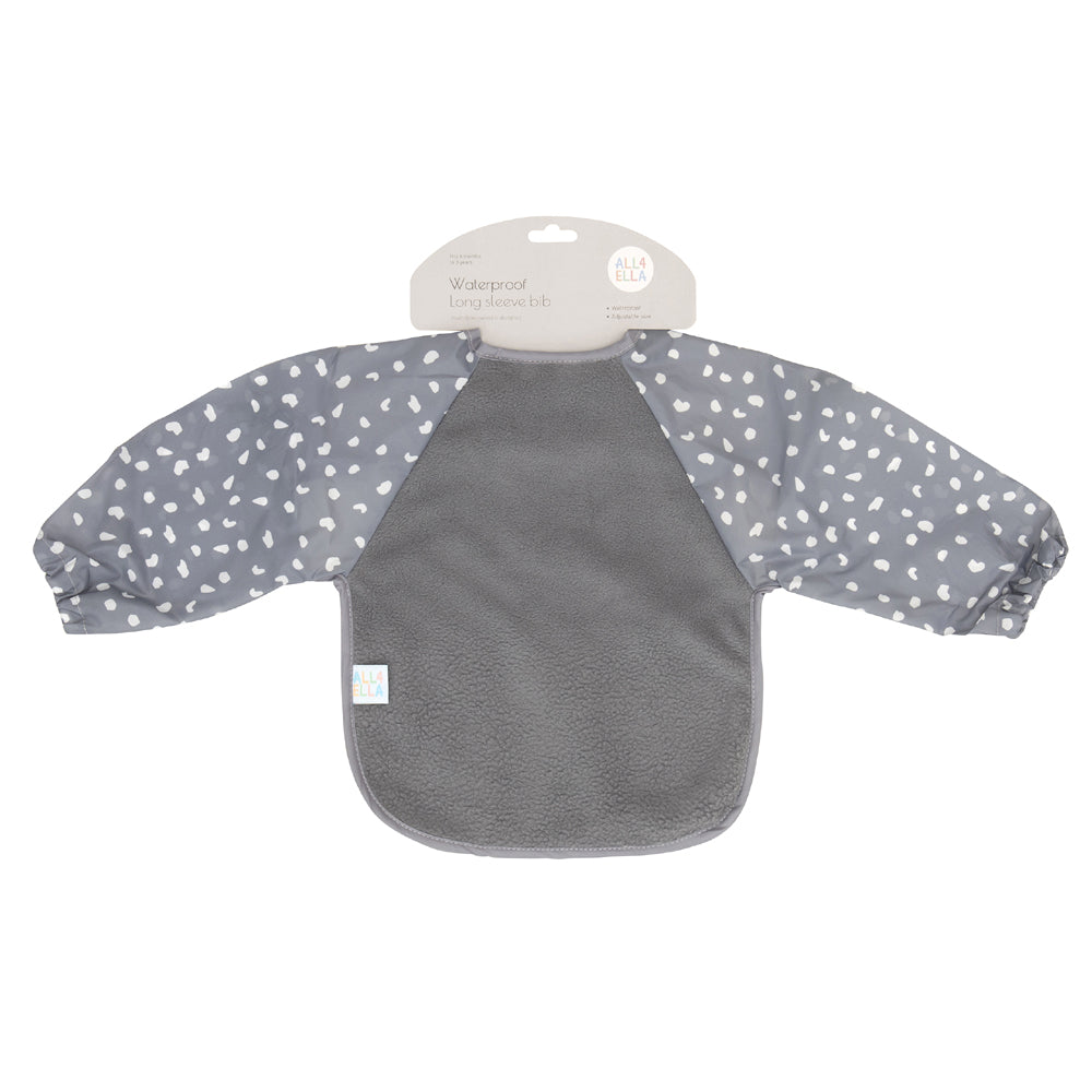 The All4Ella Long Sleeve Waterproof Bib by All4Ella features soft terry fleece in solid gray with white polka dot sleeves, elastic wrists, and adjustable snaps for a secure fit. Displayed on a white background.