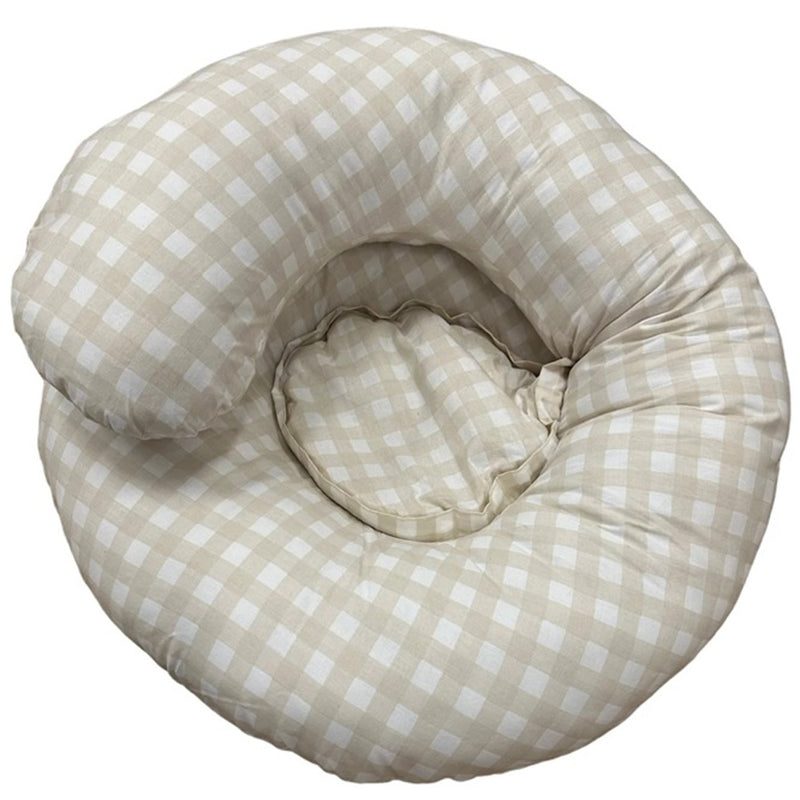 The Baby Studio Ultimate Body Pillow Gingham Beige by Baby Studio is a soft, cushioned, spiral-shaped maternity pillow in beige and white checks, designed for baby feeding support or parent comfort.