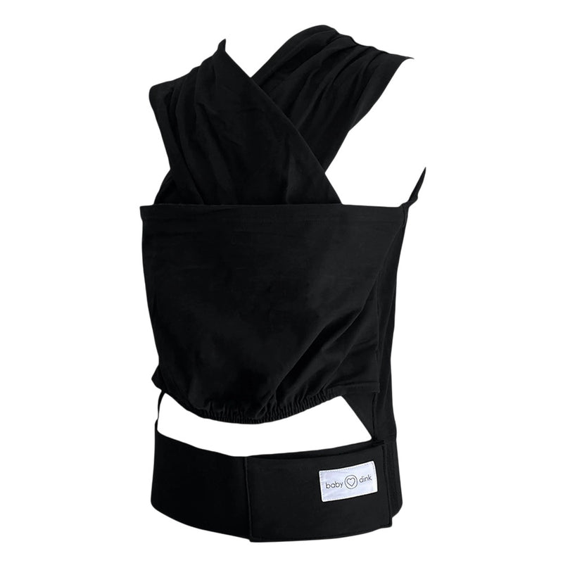 The BabyDink Carrier Black by BabyDink is shown on a white mannequin torso, with crisscrossed shoulder straps and a wide front pouch, plus the "BabyDink" logo on the waistband.