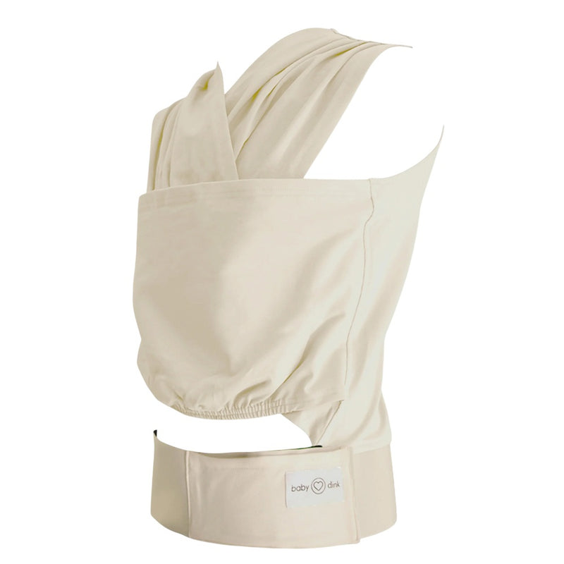 The BabyDink Carrier Ecru by BabyDink is an off-white Supima cotton carrier with wide shoulder straps, a supportive waistband, and a front pocket with a "baby dink" logo tag, shown on a white background.