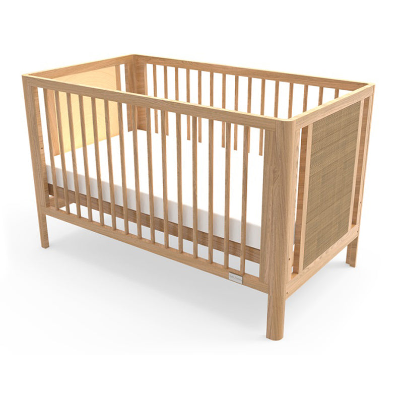 The Babyhood Aliya Cot by Babyhood is a wooden baby crib made from New Zealand plantation timber with slatted sides and ends, light-colored wood, and a white mattress, pictured on a white background.