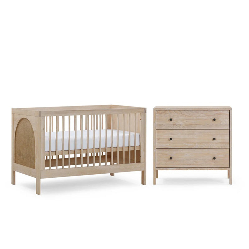 The BabyRest Grove Cot + Dresser + Mattress Nursery Package features a light wood cot with vertical slats, an arched rattan side panel, and a matching European Ash three-drawer dresser with round knobs.