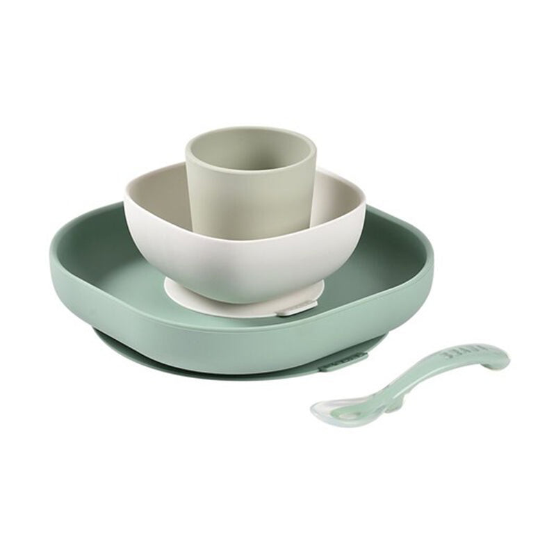 The Beaba Silicone Suction Meal Set by Beaba, in pastel green, includes a non-slip plate, bowl, cup, and spoon—perfect for baby led weaning and shown neatly arranged on a white background.