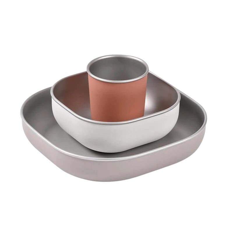 The Beaba Stainless Steel Meal Set by Beaba features a large square plate, smaller bowl, and cylindrical cup in matte gray and terracotta; microwave-safe, stackable dishware perfect for stylish children's mealtimes.