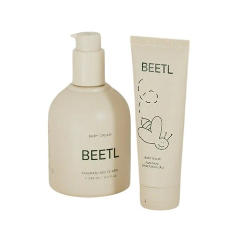 The BEETL Skincare Duo Gift Set features two beige BEETL products: a "Baby Cream" pump for barrier protection and a "Baby Balm" tube to soothe nappy rash, both with simple bee line art on the packaging.