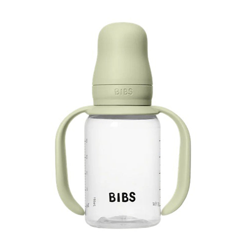 The Bibs Dummies Sippy Bottle 150ml Sage is a clear, leak-proof baby bottle with measurement markings, sage green handles, a matching cap and nipple cover, and a silicone sippy spout. "BIBS" is printed in black on the bottle.