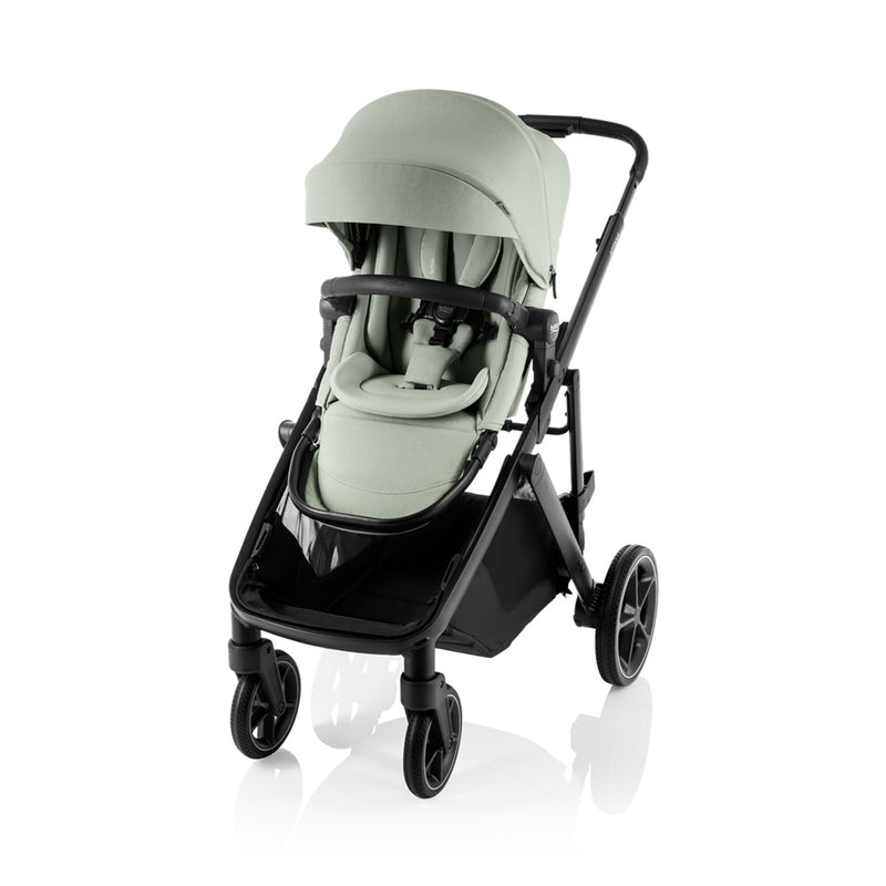 The Britax Safe-n-Sound Aptana Stroller is a modern, light green stroller with a canopy, padded seat, black frame, and four wheels—suitable for newborns and shown against a white background.