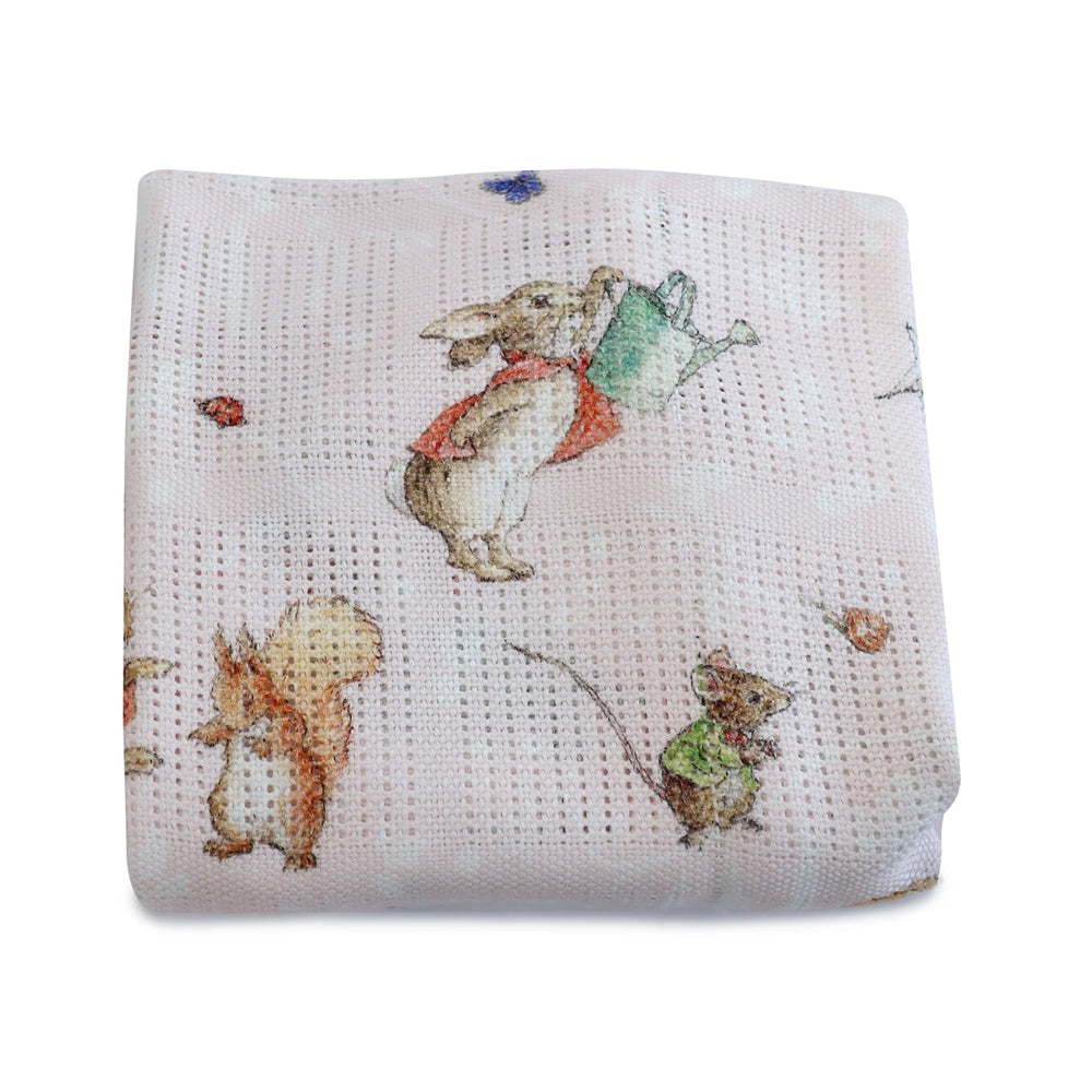 The Bubba Blue Flopsy Mopsy & Cottontail Digital Print Cellular Blanket is a white bamboo cotton baby blanket with rabbit, squirrel, and mouse illustrations on a subtle grid pattern, from the Bubba Blue brand.