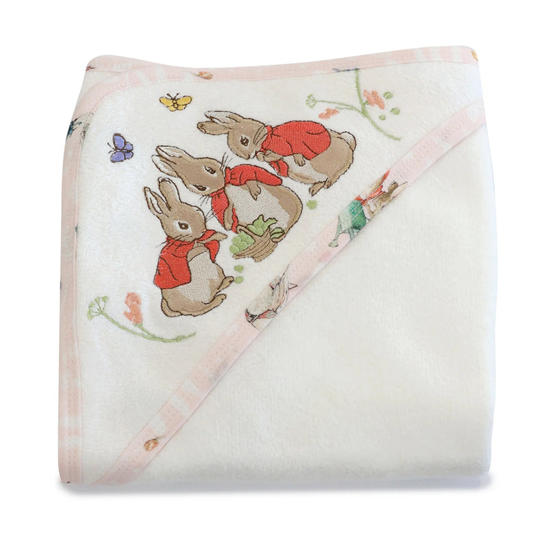 The Bubba Blue Flopsy Mopsy & Cottontail Hooded Towel is a soft white baby towel with a pink border, decorated in one corner with three rabbits in red jackets, butterflies, and flowers.