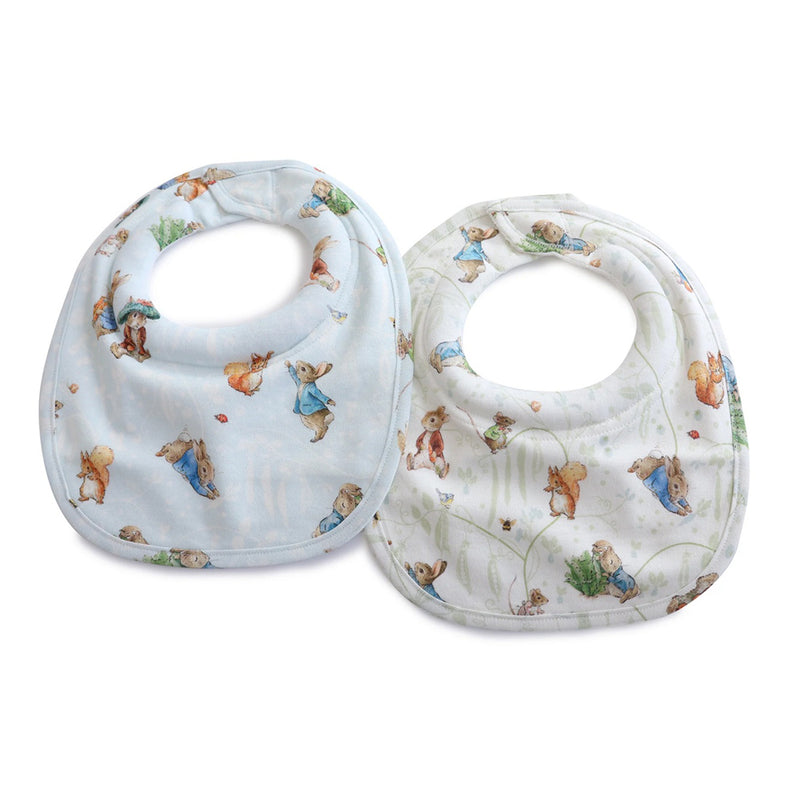 The Bubba Blue Peter Rabbit & Benjamin Bunny 2PK Dribble Bibs feature playful animal designs and round neck openings. These waterproof bibs are gentle, whimsical, and perfect for little ones.