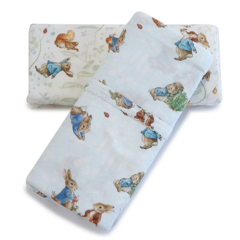 Two Bubba Blue Peter Rabbit & Benjamin Bunny 2PK Jersey Wraps are neatly stacked, featuring playful animal prints in soft colors on white. These cozy, stretch swaddles offer a delightful design for your baby.