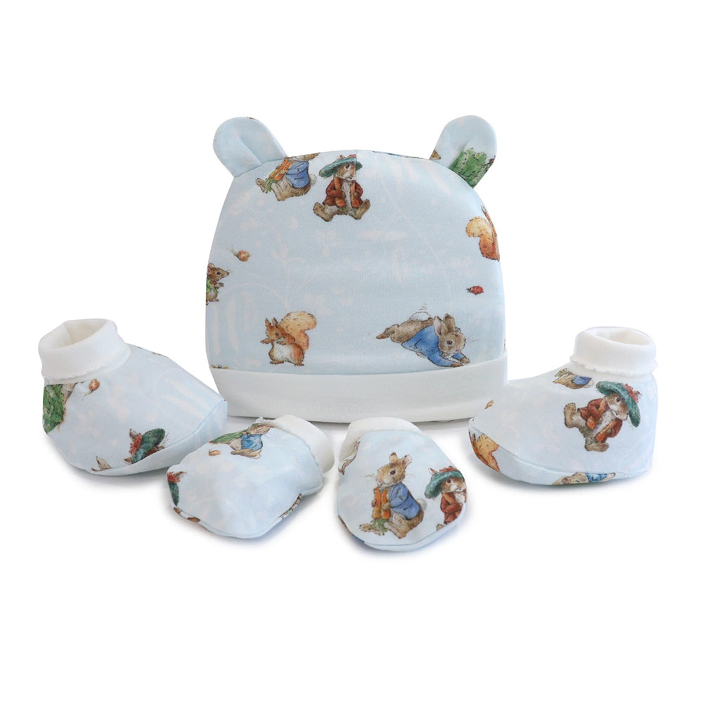 The Bubba Blue Peter Rabbit & Benjamin Bunny 3PCS Layette Set includes a hat, two pairs of mittens, and two pairs of booties in light blue with cute animal prints—an ideal newborn gift set from Bubba Blue.