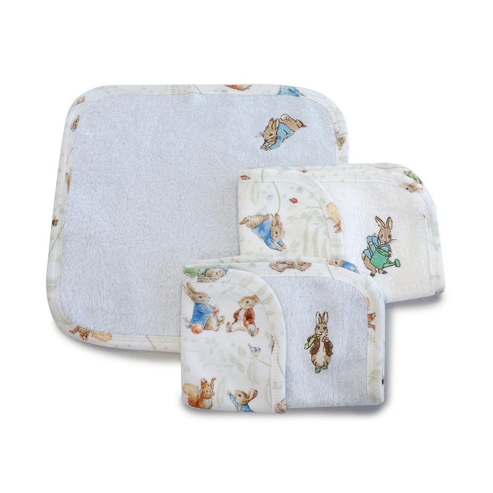 The Bubba Blue Peter Rabbit & Benjamin Bunny 3PK Face Washers feature pastel colors, soft towelling on one side, printed borders, and charming character designs—perfect for bath time. Shown here on a white background.
