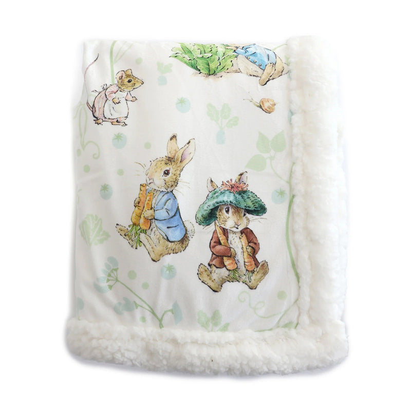 The Bubba Blue Peter Rabbit & Benjamin Bunny Cuddle Blanket features a soft white fabric, fluffy border, and charming illustrations of storybook rabbits in clothing and a mouse—perfect for a cozy nursery.