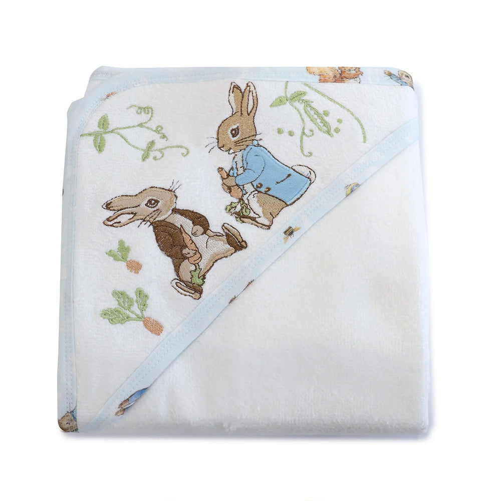 The Bubba Blue Peter Rabbit & Benjamin Bunny Hooded Towel is a soft, white towel with light blue trim and adorable Peter Rabbit-inspired embroidery, folded to showcase the design on the hood.
