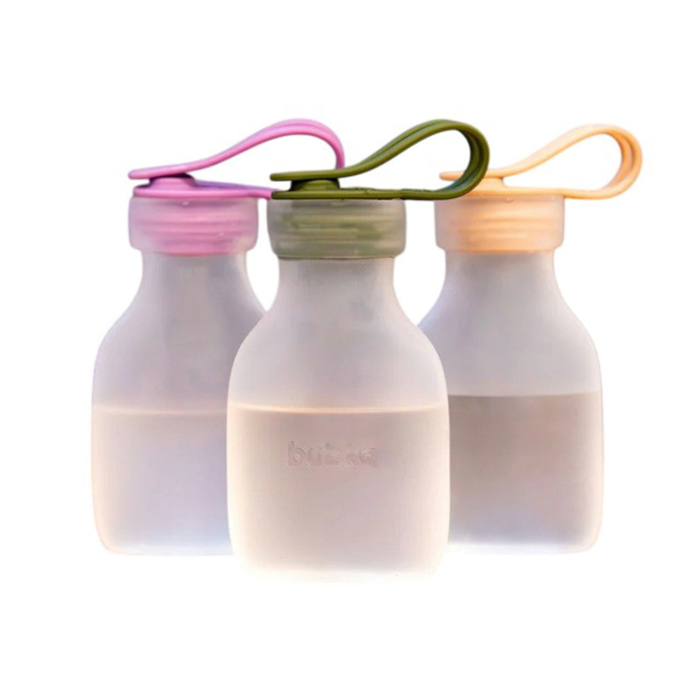 The Bubka Reusable Milk Bags 3pk by Bubka features three translucent BPA-free silicone bottles with pink, green, and orange caps and matching loop handles—perfect for stylish breast milk storage.