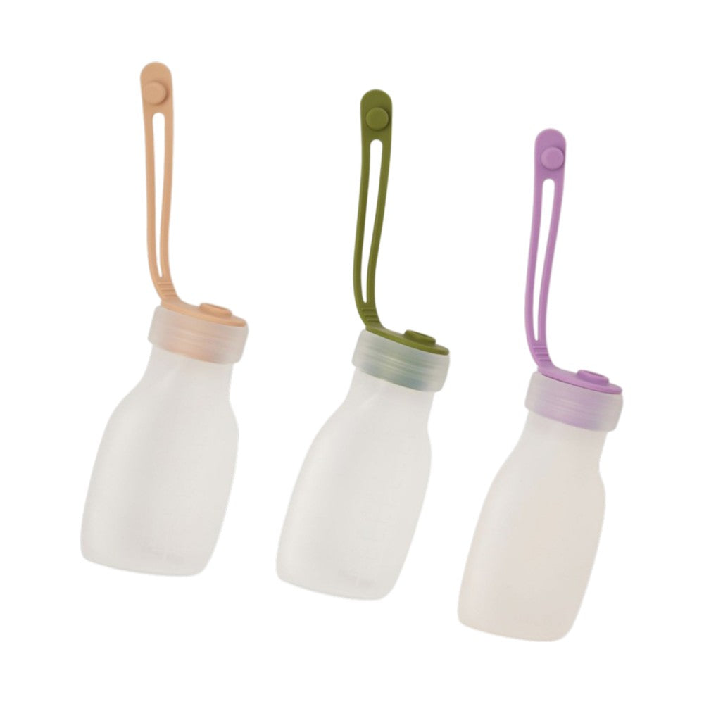 The Bubka Reusable Milk Bags 3pk by Bubka features three BPA-free silicone bottles with lids and long handles in peach, green, and purple—perfect for breast milk storage or use as reusable milk bags.